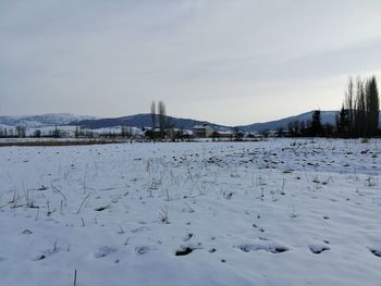 Scenic view of snow covered mountains against sky