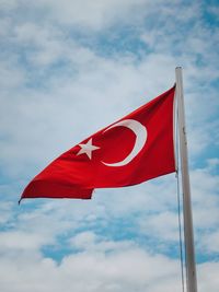 Low angle view of flag against sky