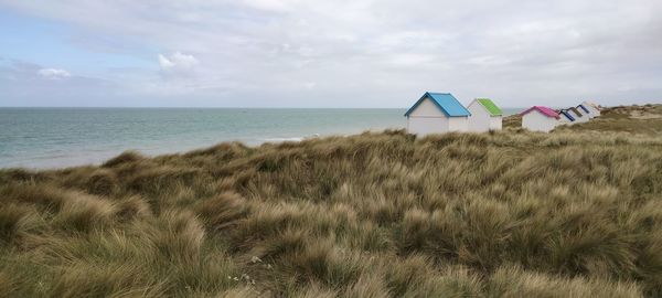 Lifeguard hut on beach against sky