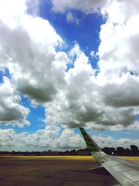 Scenic view of landscape against cloudy sky