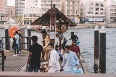 Group of people in front of buildings