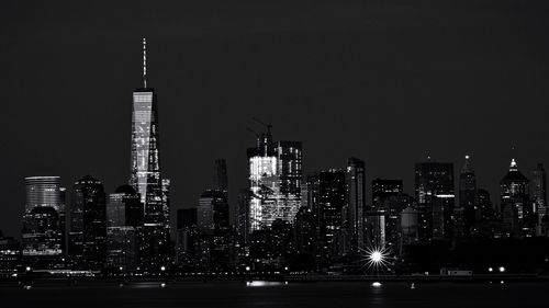 View of skyscrapers lit up at night