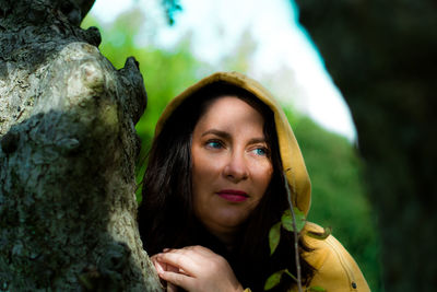 Portrait of woman against plants