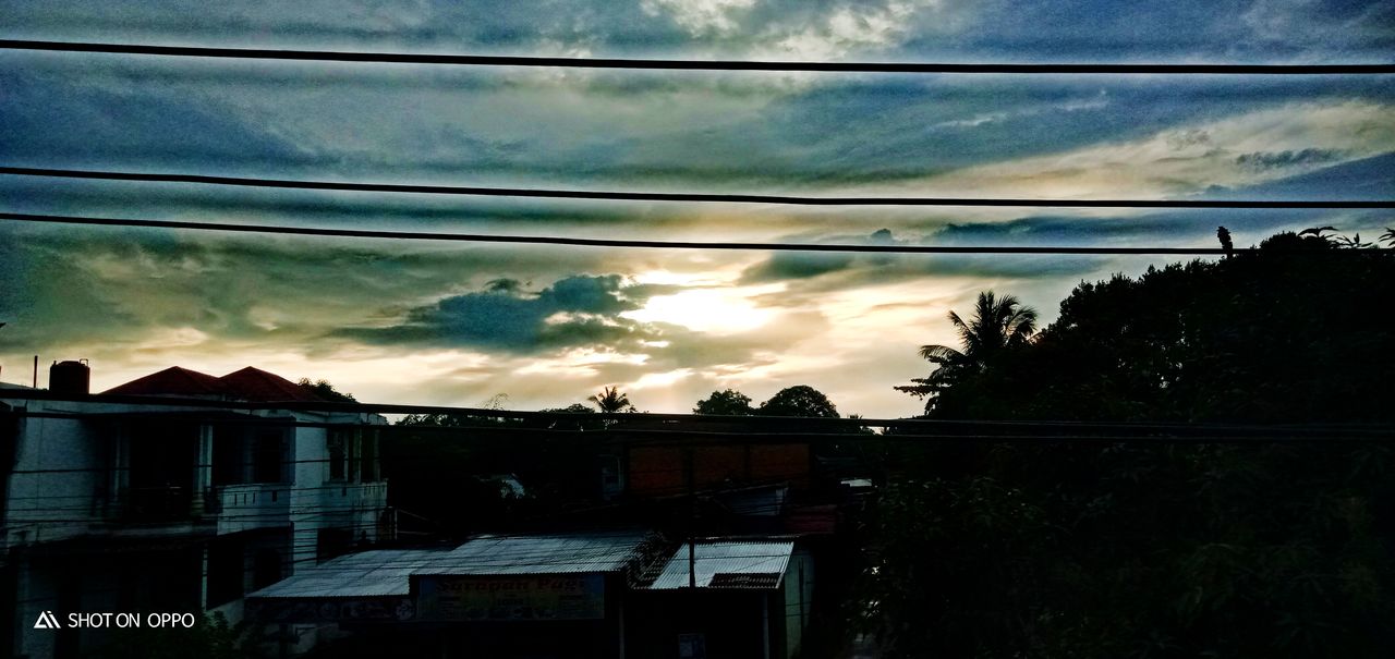 sky, cloud, architecture, built structure, building exterior, cable, nature, building, sunlight, no people, evening, darkness, light, house, sunset, electricity, silhouette, reflection, dusk, residential district, tree, city, power line, outdoors, technology, plant, low angle view, dramatic sky