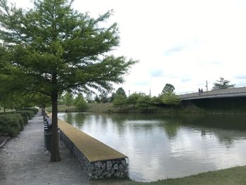 Bridge over lake against sky
