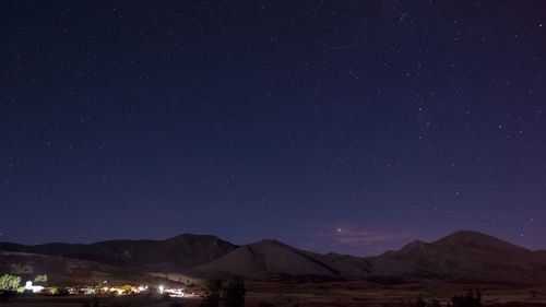 Scenic view of mountains at night