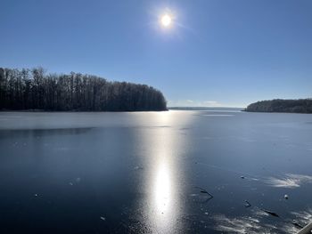 Scenic view of frozen lake against sky during winter