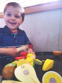 Portrait of cute smiling boy at home