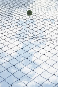 Low angle view of barbed wire on fence