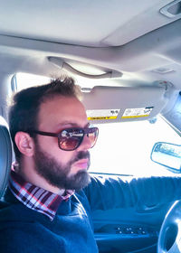 Portrait of mature woman in car