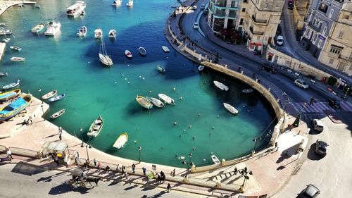 High angle view of boats in sea against sky