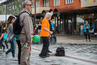 People walking on street in city