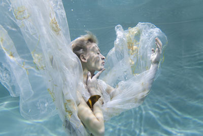 Young woman swimming in pool