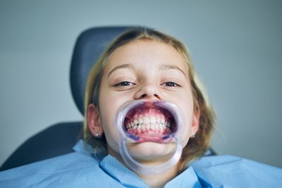 Close-up portrait of girl at dentist office