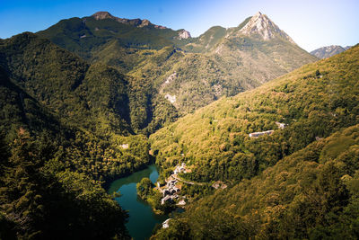 High angle view of trees and mountains against sky