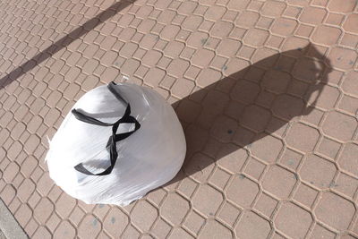 High angle view of ball on cobblestone street