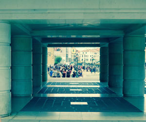 People in illuminated tunnel