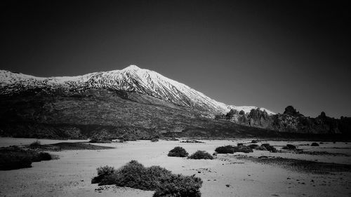 Scenic view of snow covered mountains