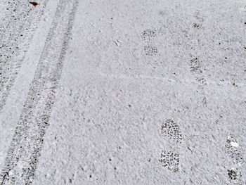 High angle view of snow on sand