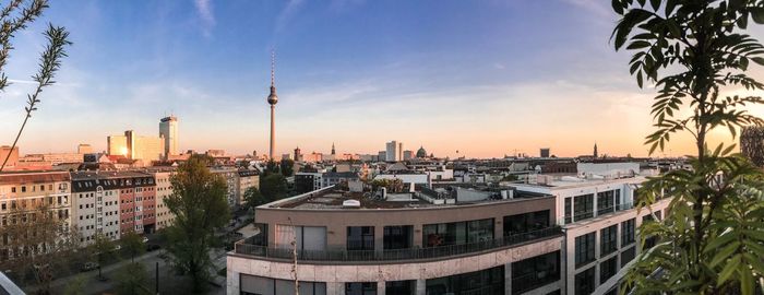 Panoramic view of buildings against sky during sunset