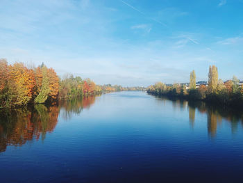 Scenic view of lake against sky during autumn