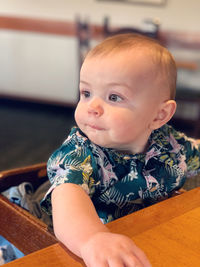Close-up of cute baby boy at home