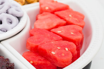 Close-up of heart shape watermelon slices in container