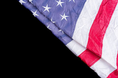 Close-up of flag against black background