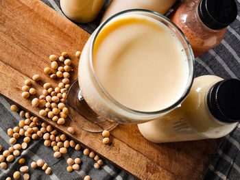 High angle view of coffee on table and soy milk is high in protein
