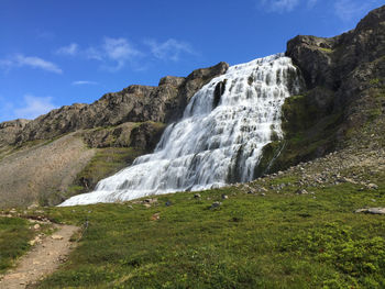 Photo of the dynjandi waterfall in iceland on a beautiful summer day