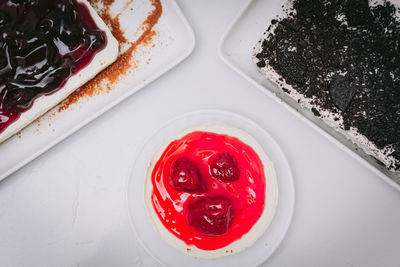 High angle view of strawberry cake in plate on table