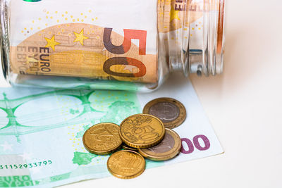 High angle view of coins on table