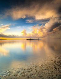 Scenic view of lake against sky during sunset