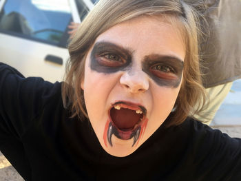 Close-up portrait of girl with halloween make-up