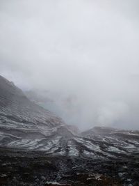 Scenic view of mountains against sky during winter