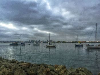 Boats moored at harbor