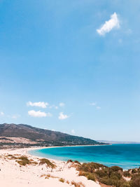 Scenic view of sea against blue sky