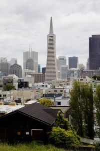 Buildings in city against sky