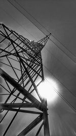 Low angle view of electricity pylon against sky