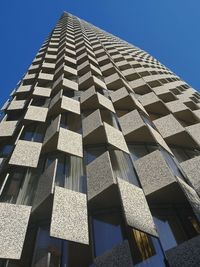 Low angle view of building against clear blue sky