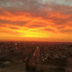 High angle view of buildings against sky during sunset