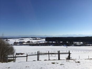 Scenic view of frozen lake against clear sky