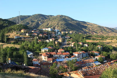 High angle view of houses and mountains against sky