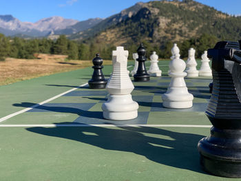 Full frame shot of chess pieces on mountain