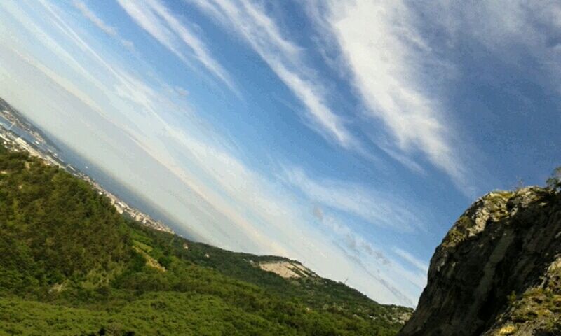 tranquil scene, scenics, tranquility, mountain, beauty in nature, landscape, sky, nature, green color, non-urban scene, idyllic, tree, remote, cloud - sky, day, mountain range, high angle view, blue, cloud, outdoors