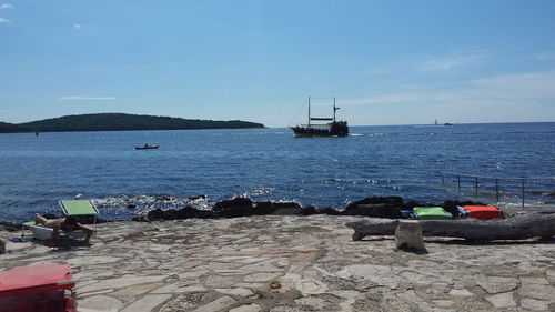 Scenic view of sea against blue sky