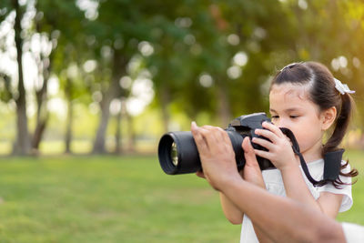 Midsection of woman photographing