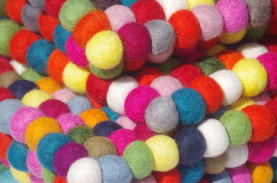 Close-up of multi colored pom poms