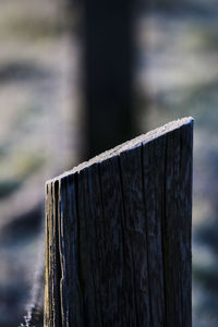 Close-up of wooden post on fence