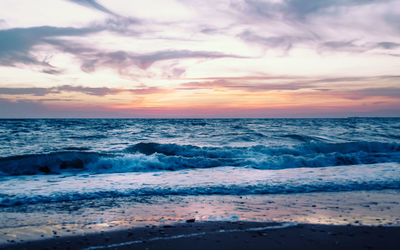 Scenic view of sea against sky during sunset